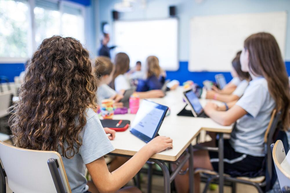 Students using tablets in a classroom